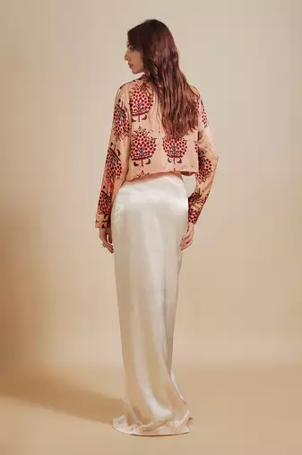 Peach printed  shirt with cream skirt