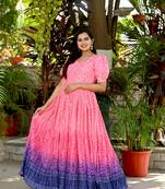 Indiatellme pink chinnon bandhej print gown with crush pleating, puff sleeves, and  v neck