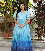 Indiatellme turquoise chinnon bandhej print gown with crush pleating, puff sleeves, and  v neck