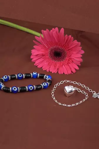 Handmade rakhi combo couple pair silver plated heart charm rakhi and blue evil eye unisex stretchable bracelet