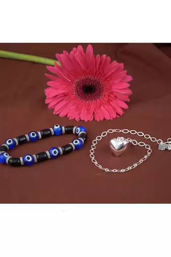 Handmade rakhi combo couple pair silver plated heart charm rakhi and blue evil eye unisex stretchable bracelet