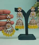 Yellow color kundan earrings with maang tikka