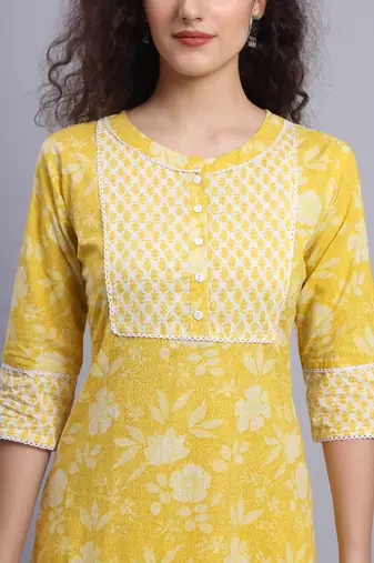 Largish cotton light yellow
 straight kurta with printed cotton trouser