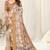 Beige silk jacquard ajrakh print golden zari border saree with unstitched blouse piece