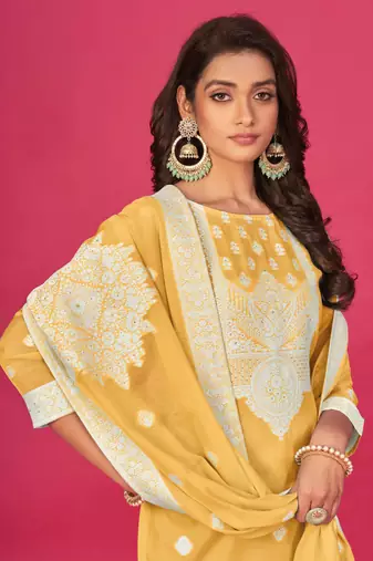 Yellow colour organza suit for trendy girlish party looks with resham work
