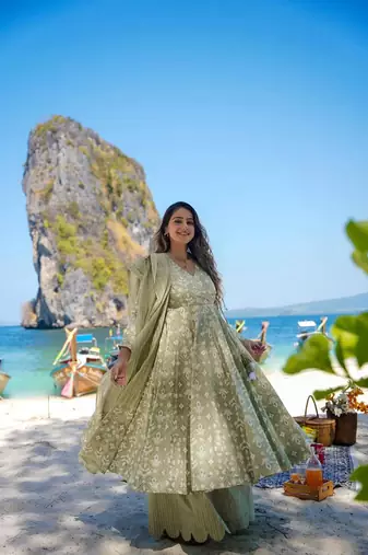Heavy and ethnic graceful looks green colour palazzo dress for partywear looks