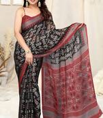 Black chiffon block print patola print chevron print chevron print border saree with unstitched blouse piece