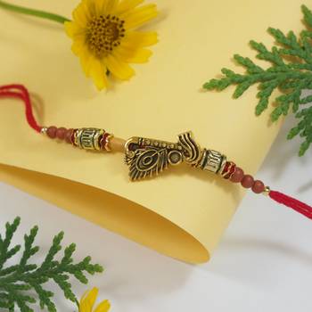 Gold plated peacock feather bhaiya rakhi with roli chawal & rakshabandhan card for men/bro/brother  1