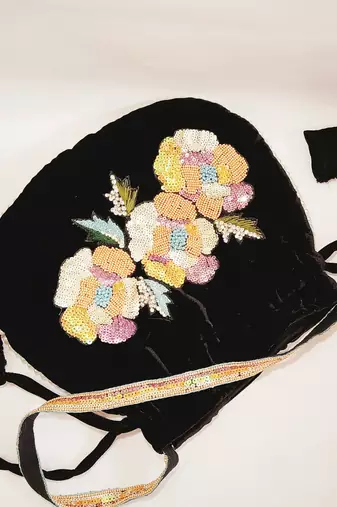 Women's embellished potli hand bag with multi color sequins beaded work