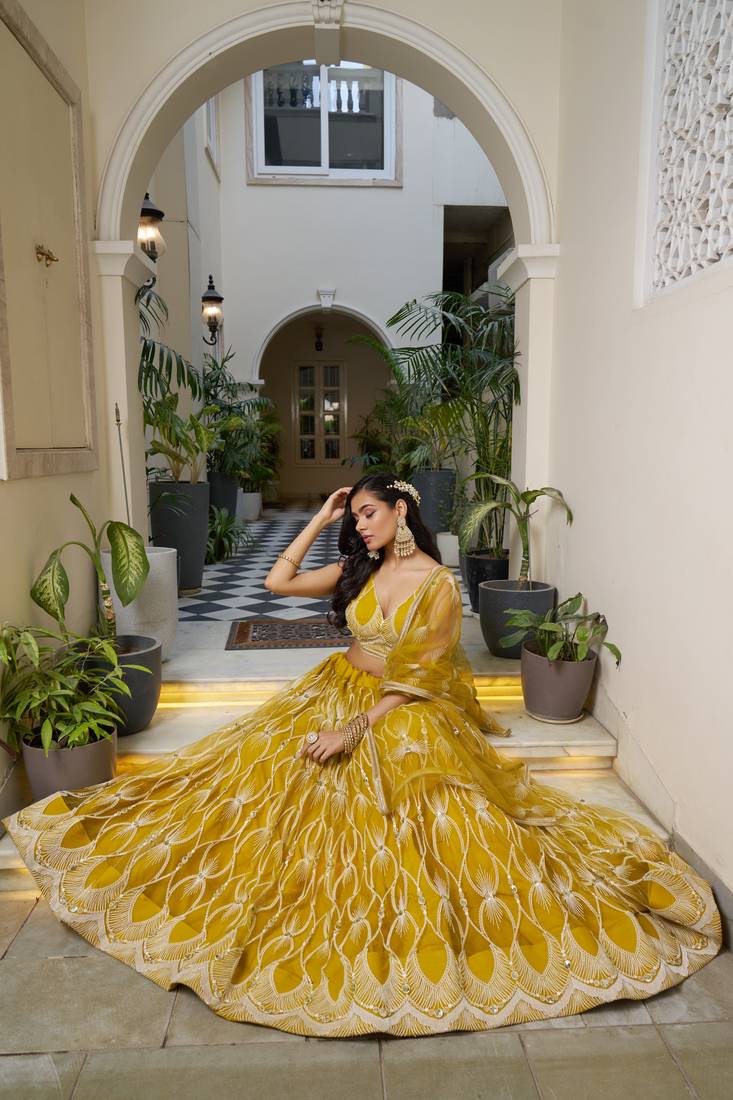 Glamorous Mustard Yellow Butterfly Net With Tone To Tone Thread And Sequence Embroidered Work Lehenga Choli For Wedding