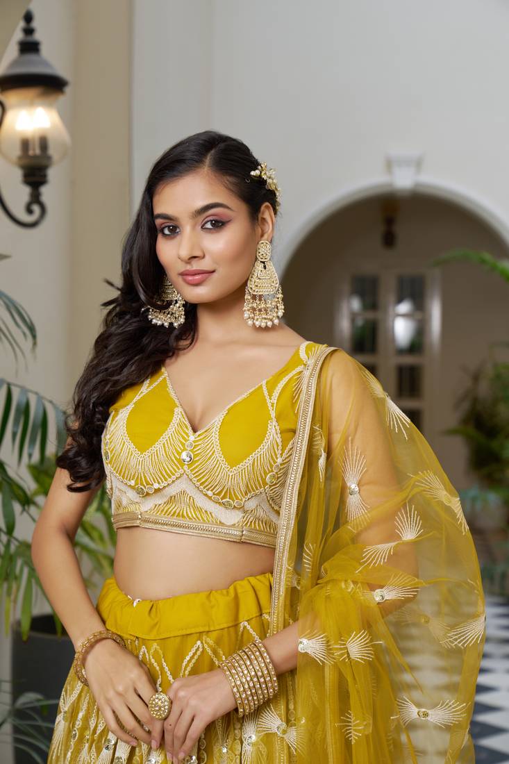 Glamorous Mustard Yellow Butterfly Net With Tone To Tone Thread And Sequence Embroidered Work Lehenga Choli For Wedding