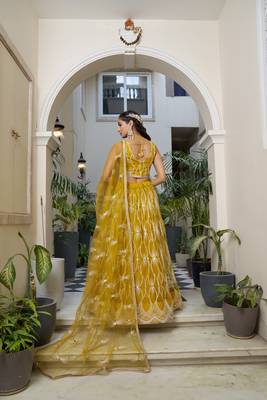 Glamorous Mustard Yellow Butterfly Net With Tone To Tone Thread And Sequence Embroidered Work Lehenga Choli For Wedding 5