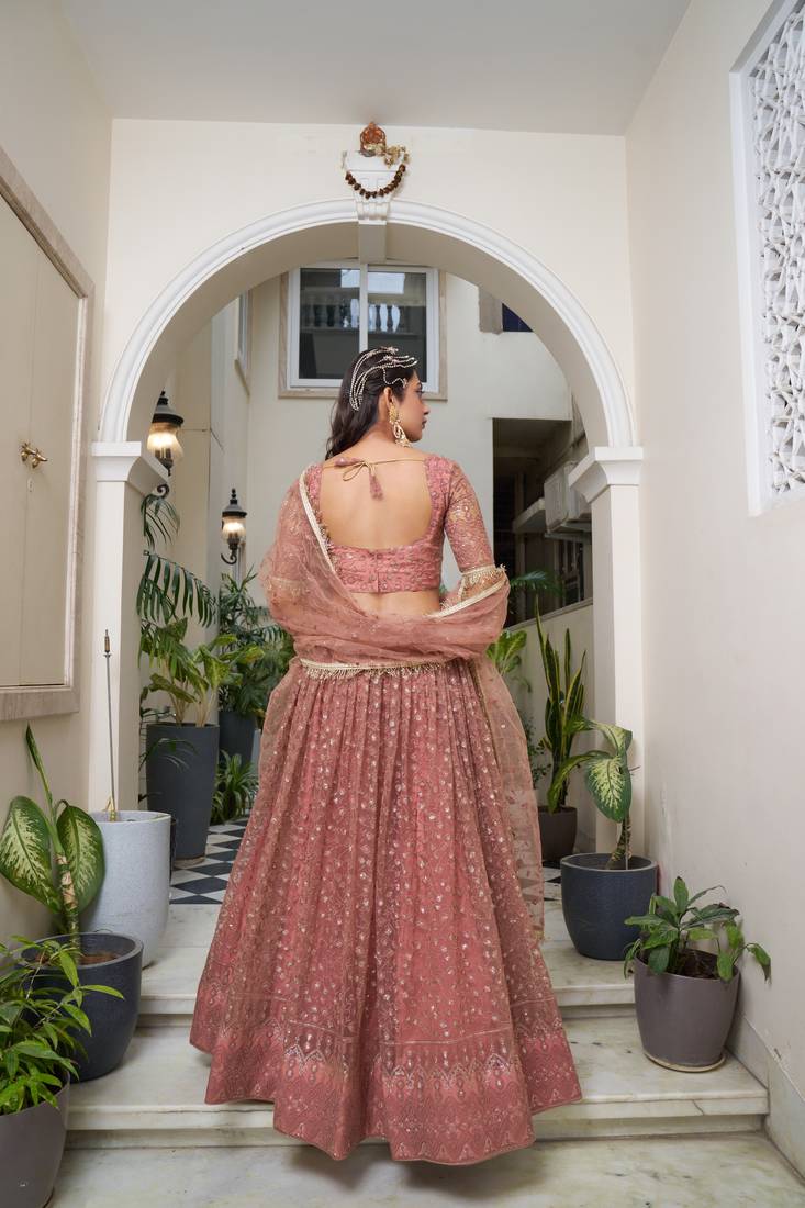 Glamorous Rust Butterfly Net With Tone To Tone Thread And Sequence Embroidered Work Lehenga Choli For Wedding