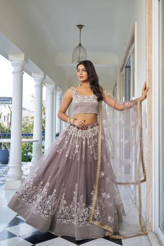 Glamorous Light Dusty Brown Butterfly Net With Thread And Sequins Embroidered Work Lehenga Choli