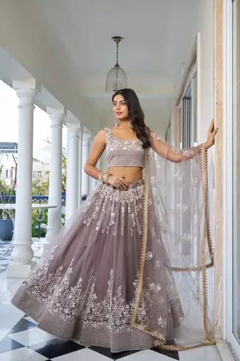 Glamorous Light Dusty Brown Butterfly Net With Thread And Sequins Embroidered Work Lehenga Choli