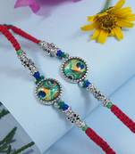 Enamel peacock feather combo rakhi with roli chawal & rakshabandhan card for men (pack of 2)