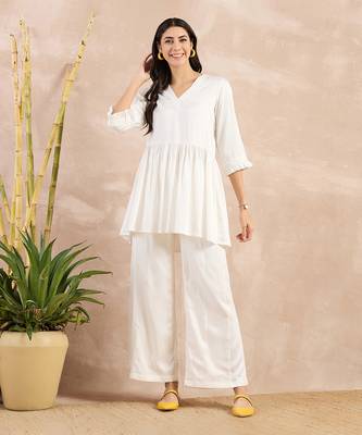 Off-white herringbone v-neck peplum top and flared trouser set 1