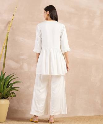Off-white herringbone v-neck peplum top and flared trouser set 4