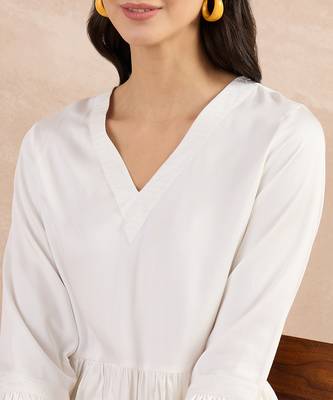 Off-white herringbone v-neck peplum top and flared trouser set 5