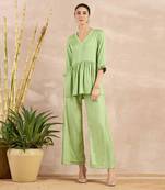 Pastel green herringbone v-neck peplum top and flared trouser set