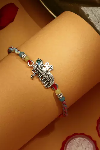 Silver Plated Krishna Thread Rakhi with Kum-Kum Chawal