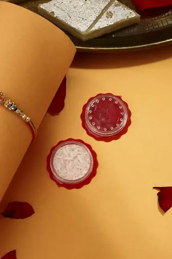 Silver Plated Pecaock Thread Rakhi with Kumkum & Chawal