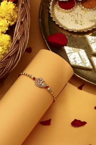 Om rakhi with american stone studs