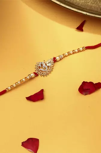 Om rakhi with american stone studs