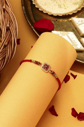 Red flower shaped with american stone studded rakhi