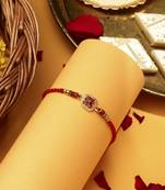 Red flower shaped with american stone studded rakhi