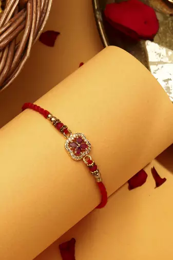 Red flower shaped with american stone studded rakhi