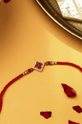 Red & white american stone studded rakhi