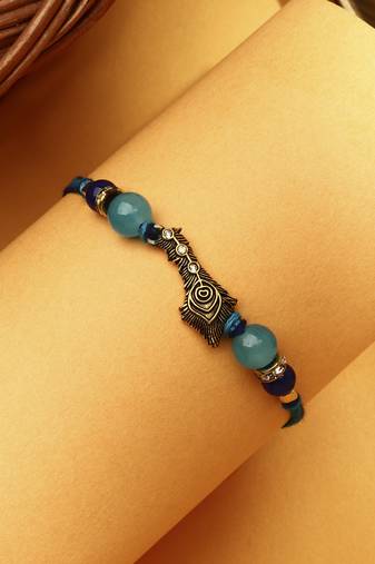Peacock feather rakhi