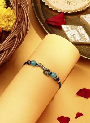 Peacock feather rakhi 2