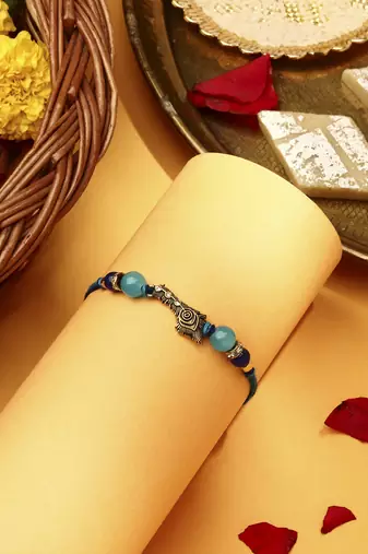 Peacock feather rakhi