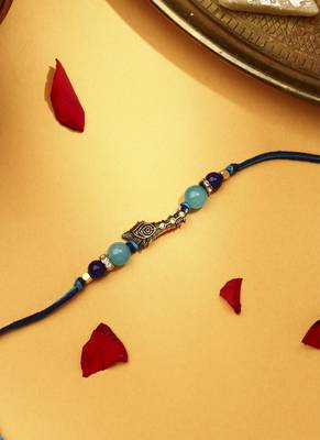 Peacock feather rakhi 3