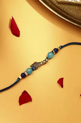 Peacock feather rakhi