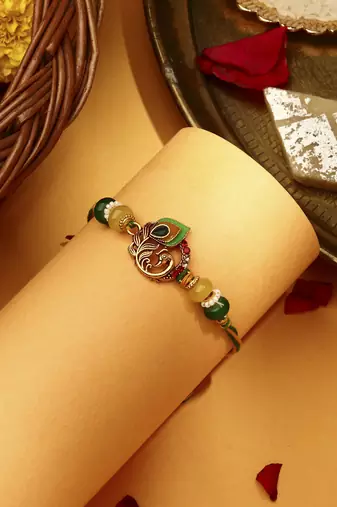 Peacock rakhi with meenakari work