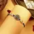 Peacock rakhi with kundan stones