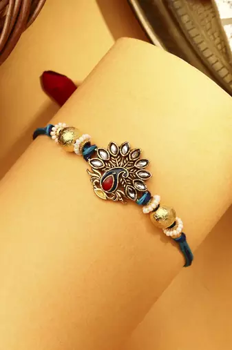 Peacock rakhi with kundan stones