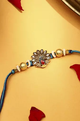 Peacock rakhi with kundan stones