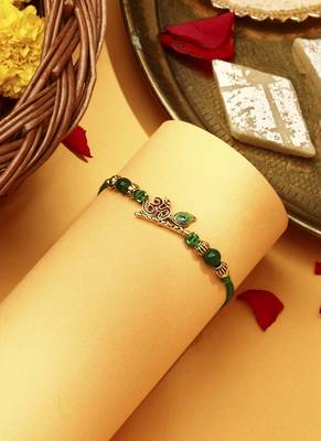 Om with flute & peacock feature rakhi 1