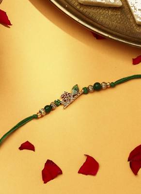 Om with flute & peacock feature rakhi 3