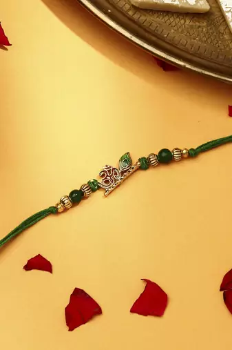 Om with flute & peacock feature rakhi