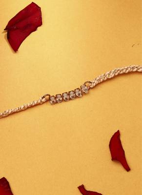 American stone studded rakhi with peach thread 3