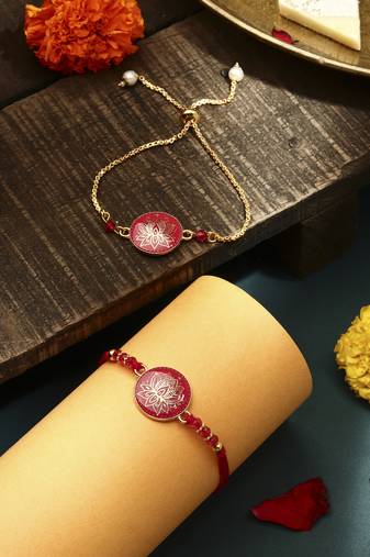 Elegant pink rakhi with golden lotus painted bhaiya bhabhi set
