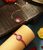 Elegant pink rakhi with golden lotus painted bhaiya bhabhi set