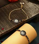 Elegant blue rakhi with golden lotus painted bhaiya bhabhi set