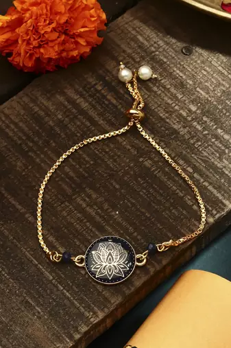 Elegant blue rakhi with golden lotus painted bhaiya bhabhi set