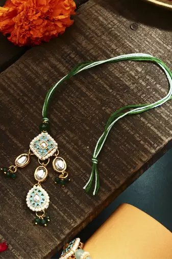 Green meenakari with kundan studded bhaiya bhabhi rakhi